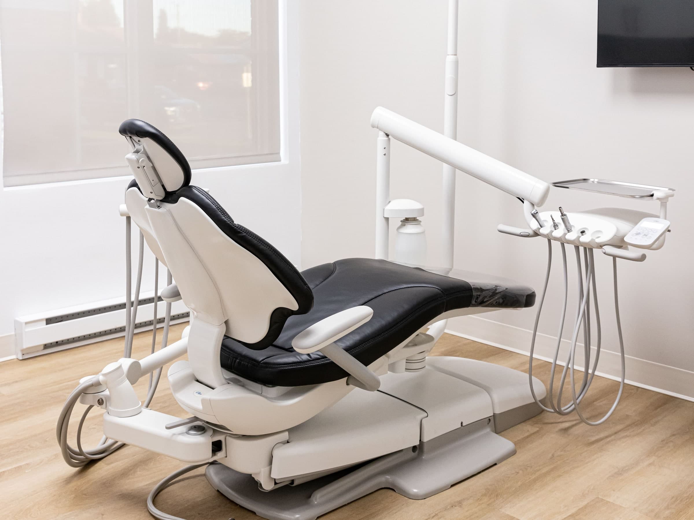 The dental chair and its unit, near the window